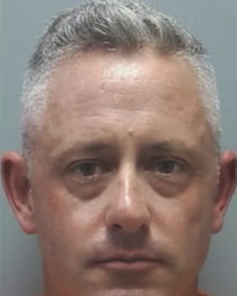 Booking photograph of Lieutenant Chris Bryant, released after his arrest in June 2026.